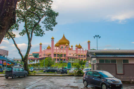 Kuching City Mosqueat day time, Sarawak, Malaysia. Masjid Bahagian.Pink mosque on a background blue skyの写真素材