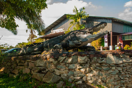 Entrance to the farm, a stuffed crocodile. Sarawak. Borneo. Malaysia. Jong's Crocodile Farm Zoo.の写真素材