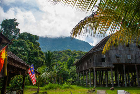 Traditional wooden house near mountain in the background in the Kuching to Sarawak Culture village.Borneo, Malaysiaの写真素材