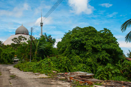 Mosque grey against the blue summer sky. Sandakan city, Borneo, Sabah, Malaysiaの写真素材