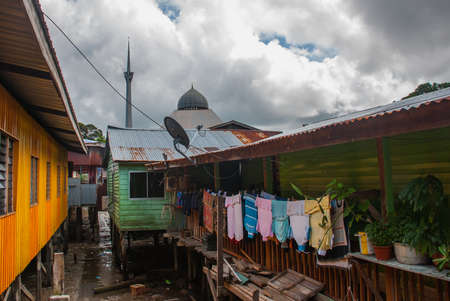 Traditional houses on stilts over the water. Sandakan city, Borneo, Sabah, Malaysiaの写真素材