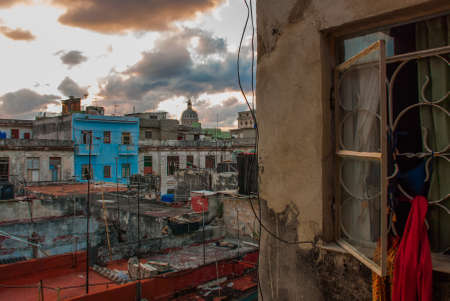 Evening landscape. Top view of the street, on ordinary houses with roofs and balconies, where clothes dr. Havana, capital of Cuba.の写真素材