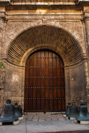Cathedral of St. Francis. Basilica Menor de San Francisco de Asis. View of the Church from the bottom up against the blue sky. Havana. Cuba.の写真素材