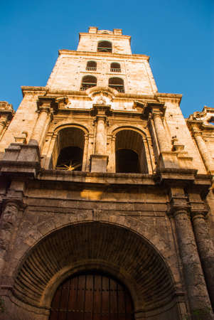 Cathedral of St. Francis. Basilica Menor de San Francisco de Asis. View of the Church from the bottom up against the blue sky. Havana. Cuba.の写真素材