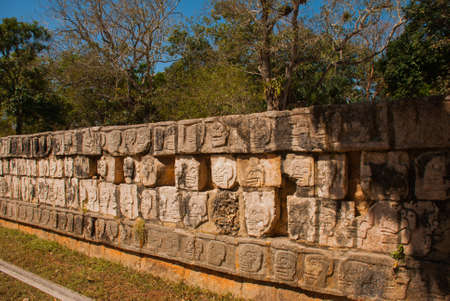 Drawings of skull on the stone of the Maya.The texture of the stone. Fragment of an old building....