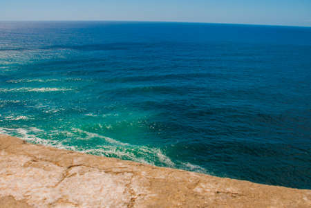 View of the bay of Santiago de Cuba, Cuba. Beautiful landscape on top of the cliff in the color of turquoise and blue waterの写真素材
