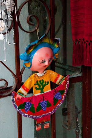 Little Mexican dolls in traditional dress at the Souvenir shop, popular place for the tourists who visit the country.の写真素材