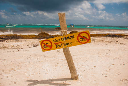 The sign plate is not for swimming,only for boats. A lot of algae, debris and mud on the beach....