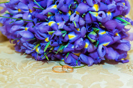 Two gold vintage wedding rings with diamonds bride and groom.