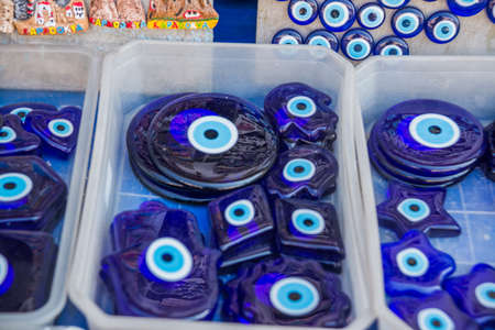 Protect Traditional Blue Evil Eyes turkish souvenir on branch tree. Sale in the market, Turkish...
