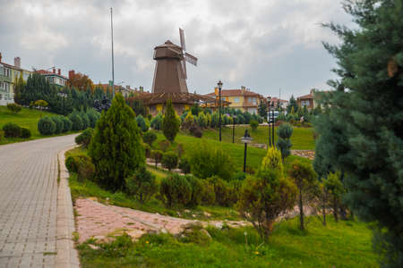 Windmill with sky as background. Sculpture of don Quixote and Sancho Panza. Selale Park, Eskisehir, Turkey. Beautiful landscape in summer in the Park.の写真素材