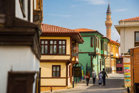 The minaret of the mosque and a typical Turkish house. Historical Homes and street from Odunpazari. Eskisehir. Eskisehir is populer tourist deatination in Turkey.の写真素材