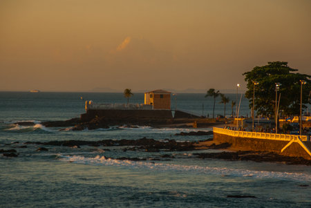 SALVADOR, BAHIA, BRAZIL: Colonial Fort Santa Maria in Barra Salvador Brazil built on tropical beach...