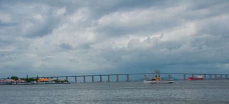 Beautiful landscape with views of the sea and the ship. Rio Niteroi Bridge in Guanabara Bay, Rio de Janeiro, Brazil, Americaの写真素材