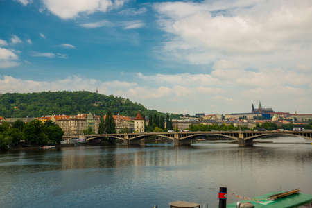 Prague, Czech Republic: : Jirasek Bridge -Jiraskuv most- over Vltava river in city of Prague in Czechia , Mala Strana district with the Castle in the background.の写真素材