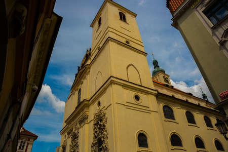 Relief sculpture on facade of the Church of Saint James The Greater with Minorite monastery in Old Town of Prague, Czech Republic, sunny dayの写真素材
