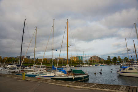COPENHAGEN, DENMARK: Luxury speedboats docked along side of wooden promenade at Danish capital of Copenhagen. Denmarkの写真素材