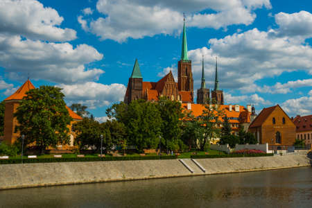 WROCLAW, POLAND: Wroclaw Old Town. Cathedral Island, Ostrow Tumski, is the oldest part of the city. Odra River and historic buildings in sunny day.の写真素材