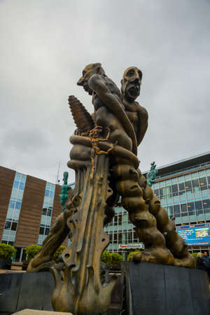 Odense, Denmark: H. C. Andersen sculpture. The old railway station building in Odense, Denmark...