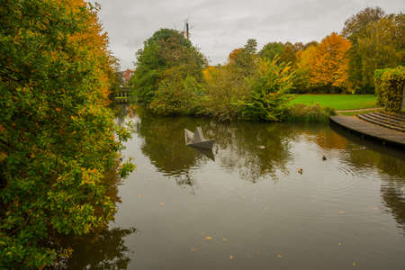 Odense, Denmark: Beautiful view of the pond in autumn in the Park. Hans Christian Andersen fairytale garden in Odense in Denmark, Europeの写真素材