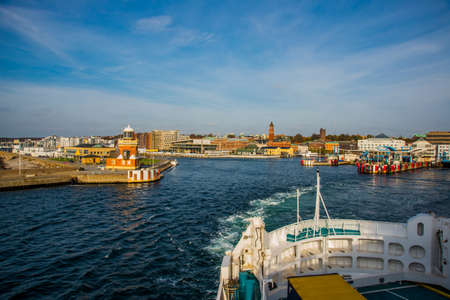 HELSINGBORG, SWEDEN: An image of a passenger ferry commuting between Helsinborg in Sweden and Helsingor in Denmark. Beautiful view of the sea and the city.の写真素材