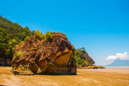 BAKO, KUCHING, SARAWAK, BORNEO, MALAYSIA: beautiful landscape with views of the Bako national Park beach landscape with rocks with mountain views, near Kuchingの写真素材