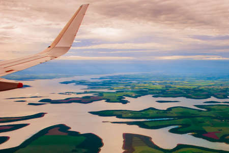 Manaus, Amazonas, Brazil, South America: Top view of the river. Beautiful landscape from the window of the airplane.の素材 [FY310147893560]