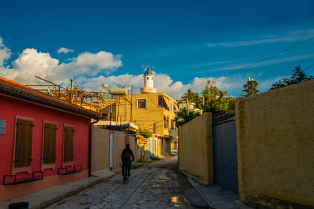 VLORA / VLORE, ALBANIA: Historical multi-colored buildings on the street in the city center. Shops,...