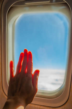 View from a jet plane window high on the blue skies. Beautiful landscape.の写真素材