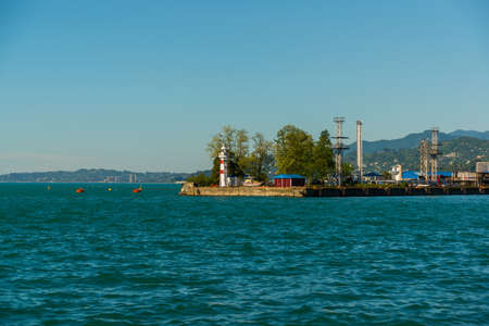 BATUMI, GEORGIA: Top view of the lighthouse at the port in Batumi on a summer day, Adjara region of...