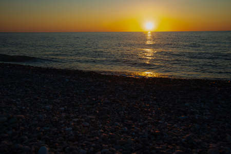 BATUMI, GEORGIA: Beautiful landscape on the beach and the black sea at sunset in Batumi, Adjara region of Georgia.の写真素材