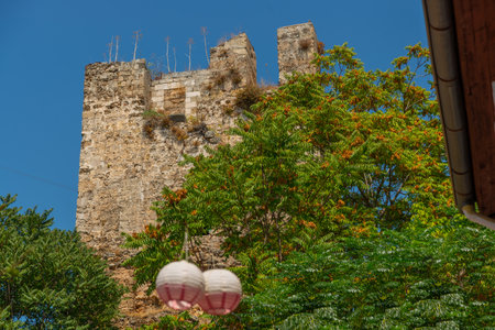 ANTALYA, TURKEY: An ancient stone fortress tower in Antalya. Old fortress walls in Antalya old town or Kaleici in Turkeyのeditorial素材