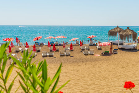 ANTALYA, TURKEY: Gazebos, sun loungers and umbrellas on the Lara beach on a sunny summer day in Antalya, Turkey.のeditorial素材