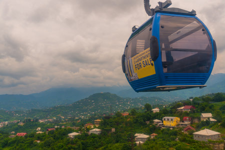 BATUMI, GEORGIA: Top view of the city from the cable car. Panorama of city buildings and mountains in the background. The ride on the cableway is one of the most popular tourist attractions in Batumiのeditorial素材