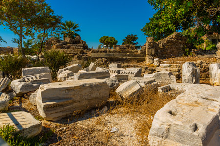 SIDE, TURKEY: Ancient ruins in the city of Side on a sunny summer day against the background of the blue sky. Side, Antalya province, Turkey.のeditorial素材