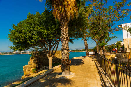 SIDE, TURKEY: The Promenade in the city of Side on a sunny summer day in the background of the blue sky.の写真素材
