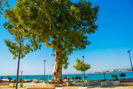 SIDE, TURKEY: The Promenade in the city of Side on a sunny summer day in the background of the blue sky.の写真素材