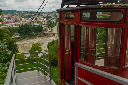 KUTAISI, GEORGIA: Beautiful landscape with a view of the Cable car across the Rioni River in Kutaisi on a sunny summer day.のeditorial素材