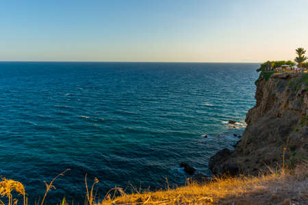 ANTALYA, TURKEY: Beautiful park and cliff slope at Waterfall Duden on a summer evening day in...