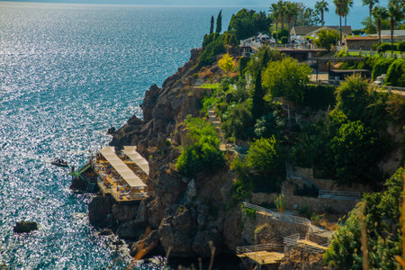 ANTALYA, TURKEY: View of a small beach in the rocks in the Turkish city of Antalya on a sunny summer day. Antalya is Turkey's biggest international sea resort located on Turkish Riviera.のeditorial素材
