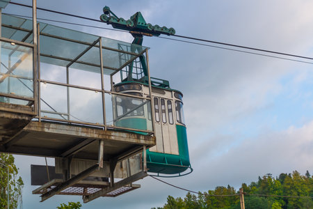 MARTVILI, GEORGIA: Turquoise cable car in the city of Martvili in cloudy weather in the evening.