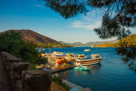 ICMELER, MUGLA, TURKEY: Beautiful landscape with a view of the coast and ships in Icmeler on a sunny summer day, near Marmaris in Turkey.のeditorial素材