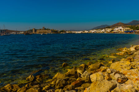 BODRUM, TURKEY: Landscape with a view of the Castle of St. Petra in Bodrum on a sunny day. Seascape with sailboats and luxury yachts in the harbor on the Aegean Sea in Bodrum, Turkey.のeditorial素材