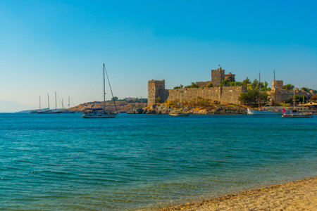 BODRUM, TURKEY: Landscape with a view of the ancient Fortress in Bodrum on a sunny day. Seascape with sailboats and luxury yachts in the harbor on the Aegean Sea in Bodrum, Turkey.のeditorial素材