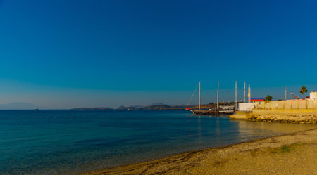 BODRUM, MUGLA, TURKEY: Beautiful seascape with a view of the ship and the mountains on the horizon in Bodrum on a sunny dayのeditorial素材