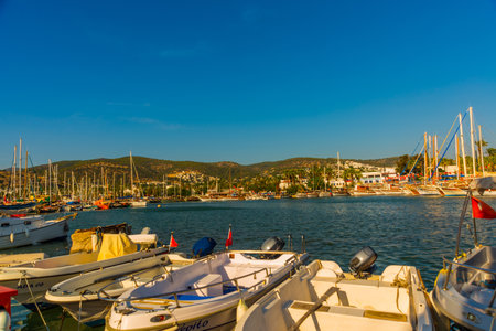 BODRUM, MUGLA, TURKEY: Luxury yachts marina at Bodrum, Marine tourist attractions in Bodrum. A colorful seascape with blue water and beautiful authentic yachts and sailing ships.のeditorial素材