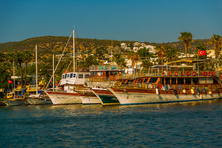 BODRUM, MUGLA, TURKEY: Luxury yachts marina at Bodrum, Marine tourist attractions in Bodrum. A colorful seascape with blue water and beautiful authentic yachts and sailing ships.のeditorial素材