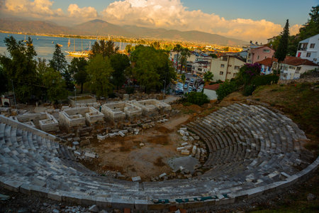 FETHIYE, TURKEY: Top view of the Amphitheater in Fethiye city center in the evening.の写真素材
