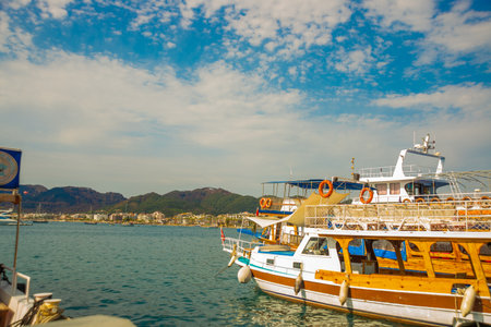 MARMARIS, MUGLA, TURKEY: View of a tourist ship at the pier in Marmaris on a sunny day.のeditorial素材