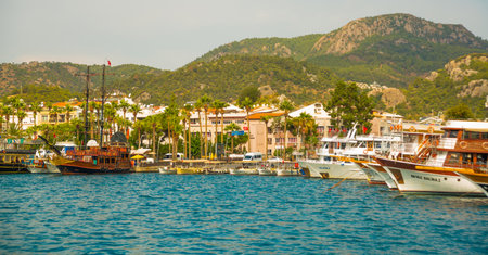 MARMARIS, MUGLA, TURKEY: Beautiful view of the mountains, the beach and the city of Marmaris on a cloudy day.のeditorial素材